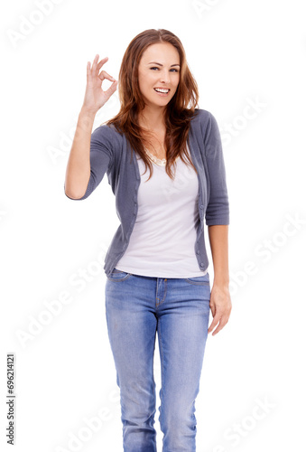 Ok, sign and portrait of woman in studio for vote, yes feedback and certified news on white background. Happy model with hand emoji for support, agreement and icon of success, review and excellence