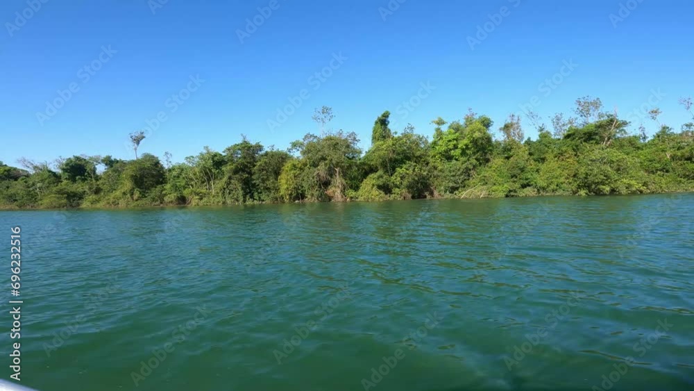 View of a boat trip along the Parana River where we can admire the magnificent forest that forms the coast,Brasil View of a boat trip along the Parana River where we can admire the magnificent forest that forms the coast,Brasil