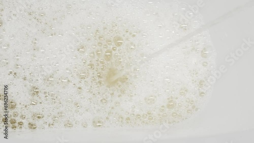 A stream of urine in a white toilet