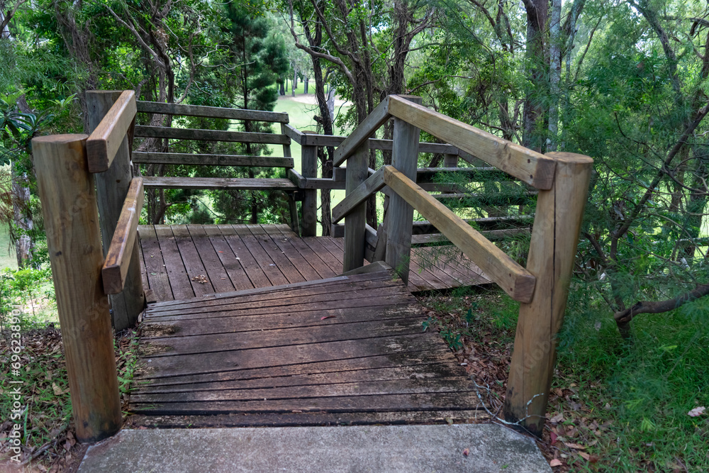 Entrance to weathered wooden stairs leading down a steep slope to the Coochiemudlo Island golf course. Entrance to weathered wooden stairs leading down a steep slope to the Coochiemudlo Island golf course.