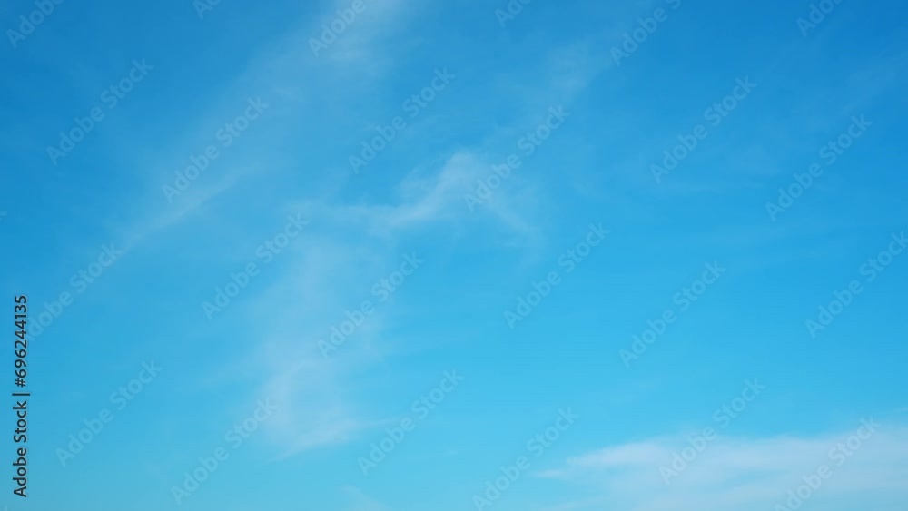 4K : Blue sky timelapse video reveals the ever-changing canvas of the sky. Wispy clouds dance across the brilliant blue expanse, painting a dynamic masterpiece in the heavens. Summer sky background.
4K : Blue sky timelapse video reveals the ever-changing canvas of the sky. Wispy clouds dance across the brilliant blue expanse, painting a dynamic masterpiece in the heavens. Summer sky background.