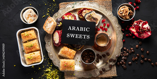 Hot tasty coffee with various pieces of turkish delight desets on a dark background. Traditional arabian food © bit24