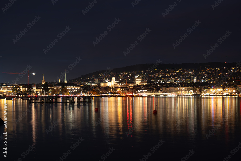 Lake Zurich at night. Old town city light reflected on the water surface, no people