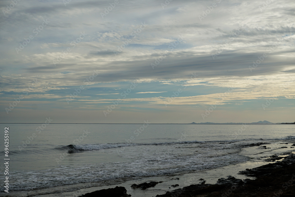 Beautiful evening sky over the sea on the shore of the city of Torrevieja in Spain Beautiful evening sky over the sea on the shore of the city of Torrevieja in Spain