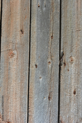 Unusual old wood, wooden boards with old peeling paint with an interesting textured structure with old rusty nails and crevices.