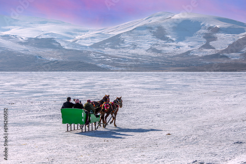 Sleigh pulled by a horse in lake frozen Cildir. Traditional Turkish winter fun. Cildir Lake , Kars , Turkey