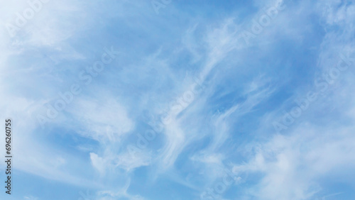 Whispy beautiful clouds at blue sky. Bright summer day. Atmosphere sky background