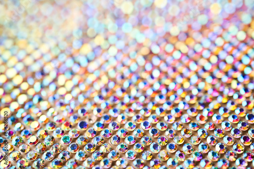 Abstract background made of rhinestones shimmering in the light.