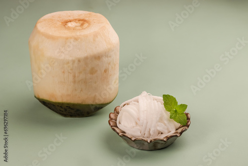 Slice of Young Coconut Meat with Young Coconut. photo