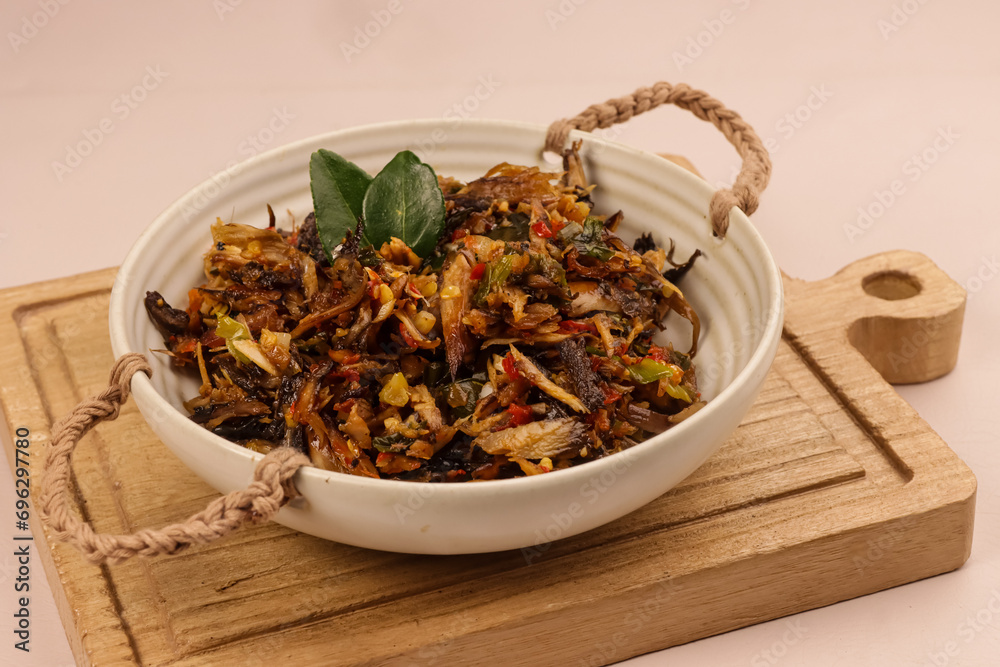 Cakalang Fufu Rabe Rica is Minahasan Traditional Food Made From Shredded Smoked Cakalang (Skipjack Tuna) with Crushed Red Chili Pepper. Cakalang Fufu Rabe Rica is Minahasan Traditional Food Made From Shredded Smoked Cakalang (Skipjack Tuna) with Crushed Red Chili Pepper.