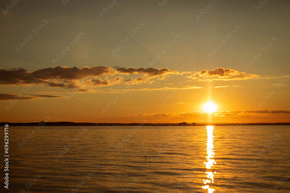 Fototapeta premium orange sunset in summer on the lake 