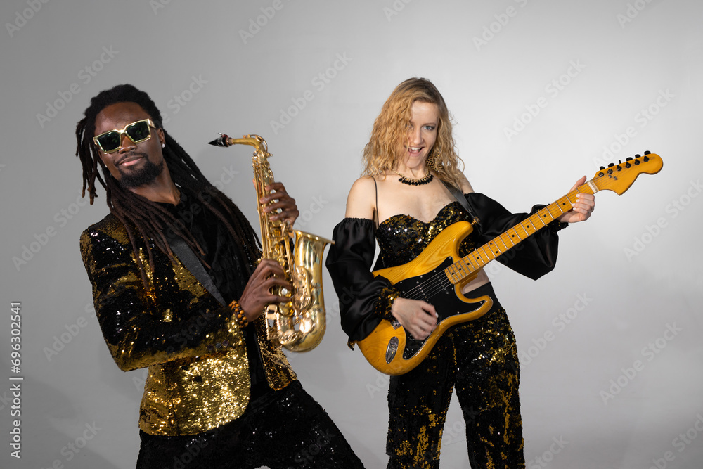 playing musical couple african man and caucasian woman on instruments playing musical couple african man and caucasian woman on instruments