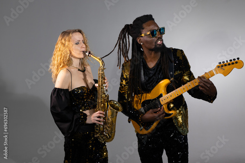 playing musical couple african man and caucasian woman on instruments