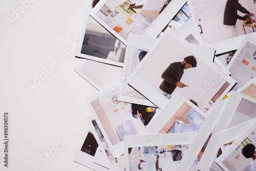 Scattered Polaroids of Creative Process. chaotic yet creative spread of Polaroid photos capturing a man in motion, actively engaging with his work in an office space filled with design plans  photo