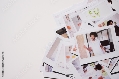 Creative Workflow Exploration.A haphazard pile of Polaroid photos illustrates a man's journey through a productive day, from focused task management to casual brainstorming in a modern office photo