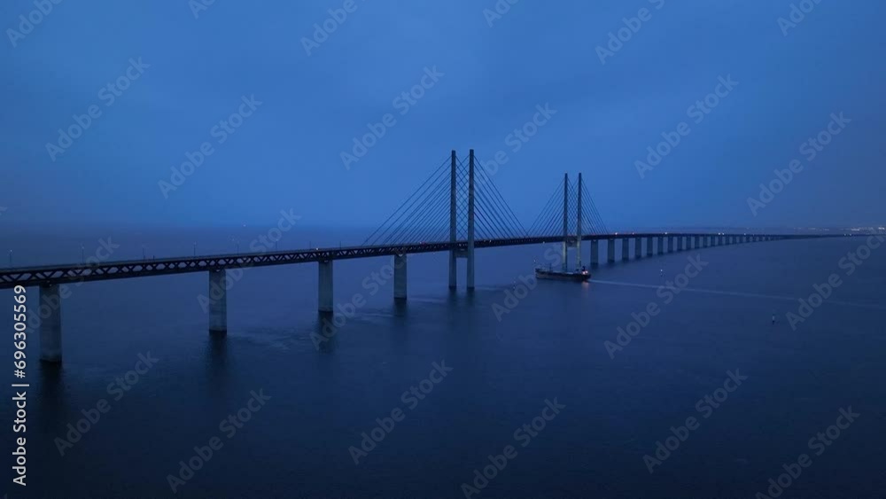 Panoramic Aerial view of Oresund Bridge who is a combined motorway and railway, sea bridge between Denmark and Sweden (Copenhagen and Malmo) and ship - seascape of Baltic Sea, Europe from above Panoramic Aerial view of Oresund Bridge who is a combined motorway and railway, sea bridge between Denmark and Sweden (Copenhagen and Malmo) and ship - seascape of Baltic Sea, Europe from above