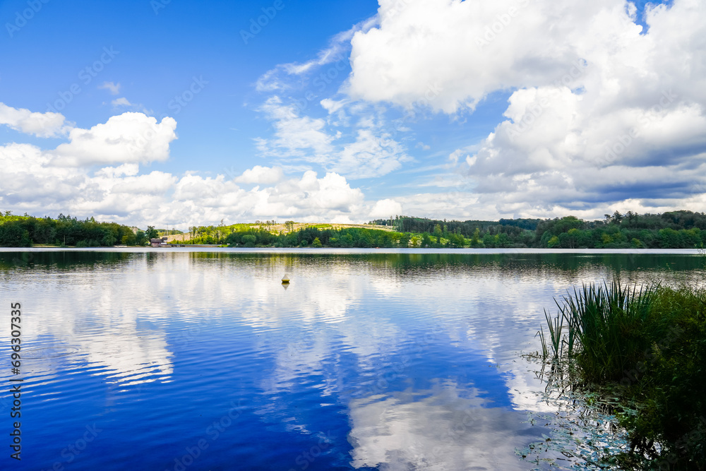 Nature at the Brucher Dam near Marienheide in North Rhine-Westphalia. View of the lake with the surrounding landscape.
