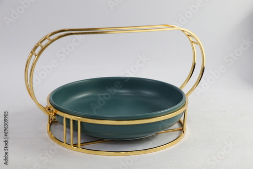 A collection of black and olive dishes inlaid with gold
