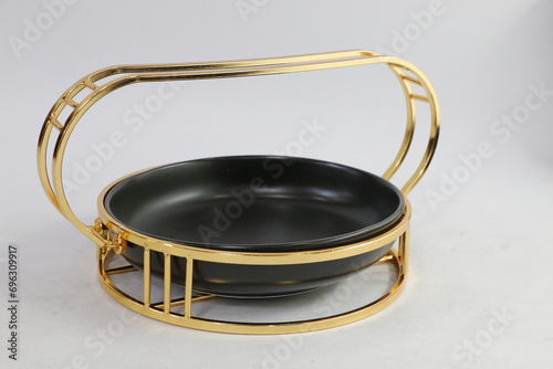 A collection of black and olive dishes inlaid with gold