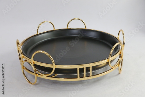 A collection of black and olive dishes inlaid with gold