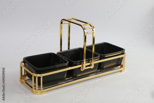 A collection of black and olive dishes inlaid with gold