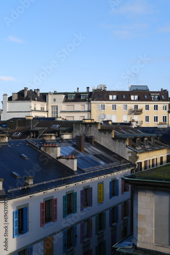 Genova, Switzerland - December 20, 2023: A view of the roofs of  Geneva city in the morning. © Yann Vernerie