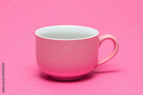 colored cup. cute pink mug on a pink background. mug for tea and coffee concept