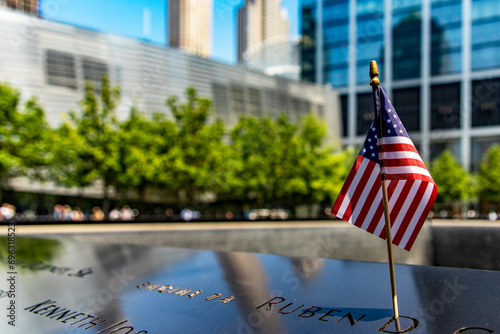Photo of an American flag at the World Trade Center memorial, a tribute to the victims of the September 11 terrorist attack in New York (USA).