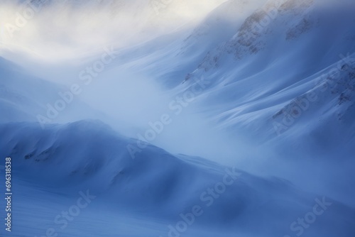 Snow covered mountains in winter, valley filled with deep fog, aerial view