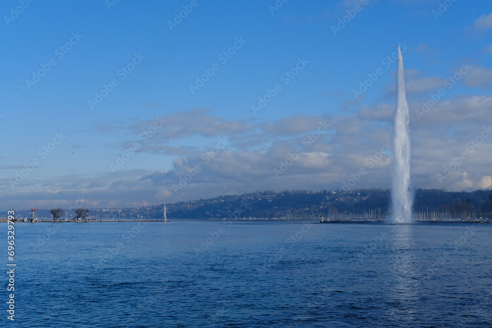 Geneva, Switzerland - December 20, 2023: the water jet of Geneva on a sunny day. Geneva, Switzerland - December 20, 2023: the water jet of Geneva on a sunny day.