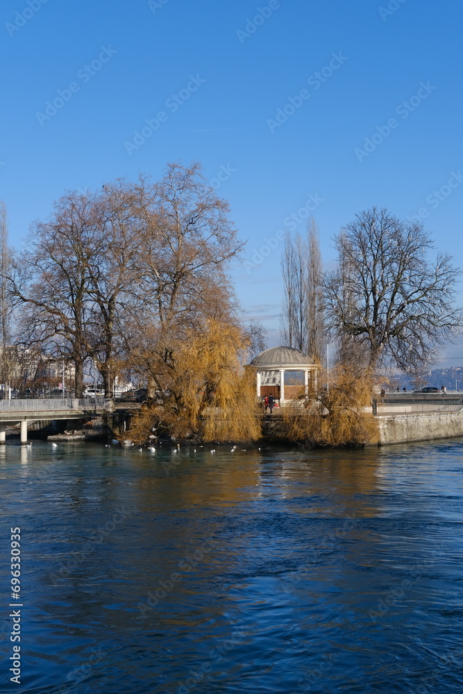 Genova, Switzerland - December 20, 2023: A view of a small park located on the Leman Lake in the city center.