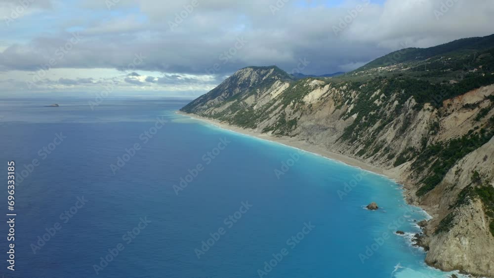 Drone aerial view of amazing Egremni beach wild coast and sea cliffs with turquoise water in Lefkada island, in Greece Drone aerial view of amazing Egremni beach wild coast and sea cliffs with turquoise water in Lefkada island, in Greece
