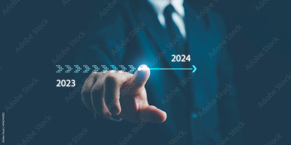 2024,Businessman touch on virtual bar status to change from 2023 to 2024, countdown of merry Christmas and happy new year by technology concept, start up on new years. start new business and new life - obrazy, fototapety, plakaty 