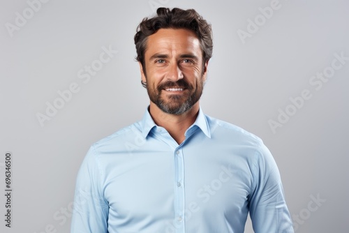 A man with a beard and a blue shirt © pham