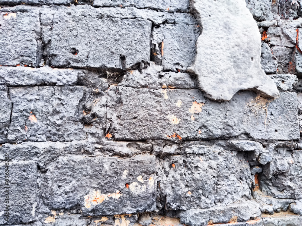 Background and texture with gray old brick and plaster remnants. Abstract background, texture, pattern, frame, place for text and copy space Background and texture with gray old brick and plaster remnants. Abstract background, texture, pattern, frame, place for text and copy space