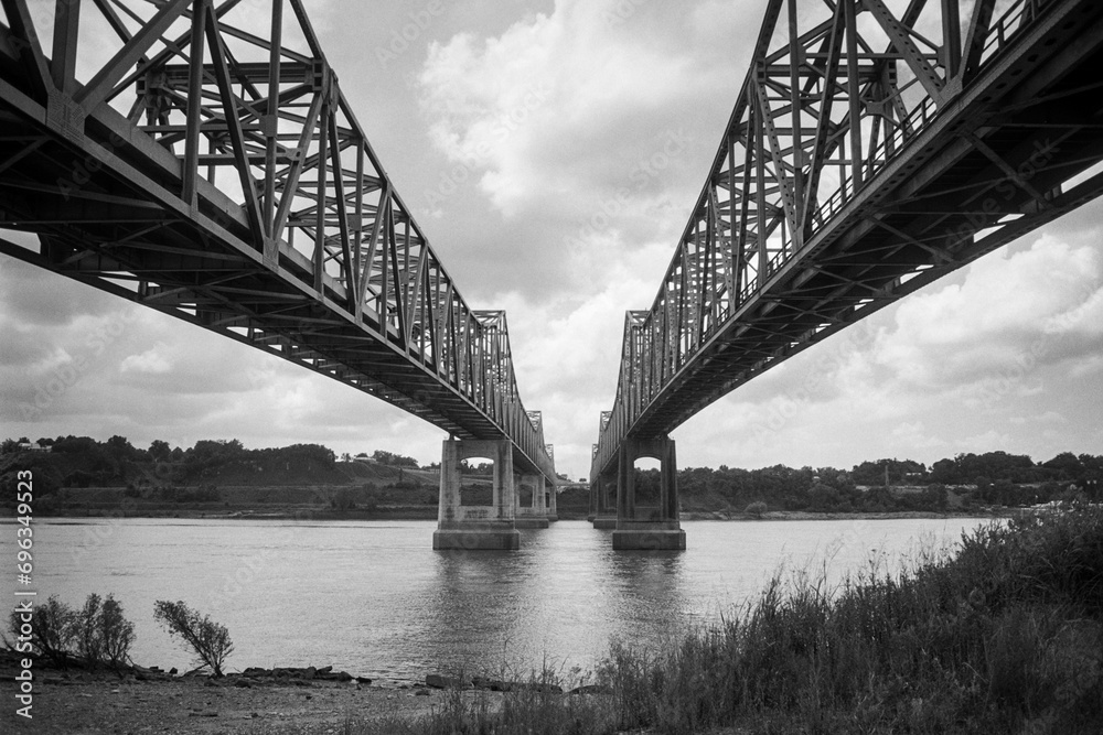 Archival black and white view under the Natchez Mississippi bridges and the Mississippi river.  Shot on film in May 1996.