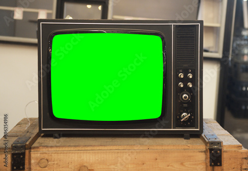 Old TV with green screen. Retro technology concept. photo