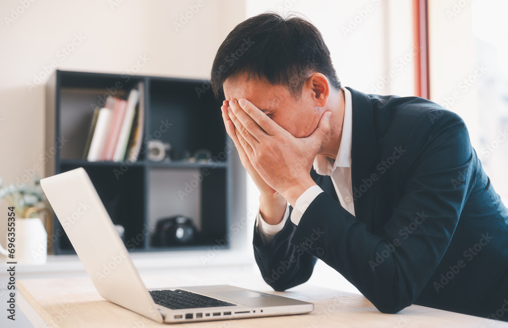 man having stressful time working on laptop headache and multitask with business man in office for deadline, burnout and overworked man having stressful time working on laptop headache and multitask with business man in office for deadline, burnout and overworked