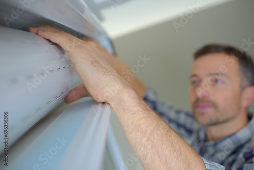 a builder mounting vertical blinds photo