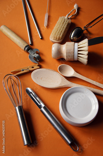 Zero waste concept. Eco-friendly kitchen tools, bamboo brush, wooden spoon, clothespin. Top view  flatlay, blue background