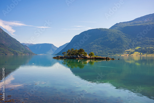 The view of the calm waters of Barsnesfjorden  the innermost part of the fjord arm Sogndalsfjorden near the Sogndal municipality from Krossen Rest Stop during a summer morning.