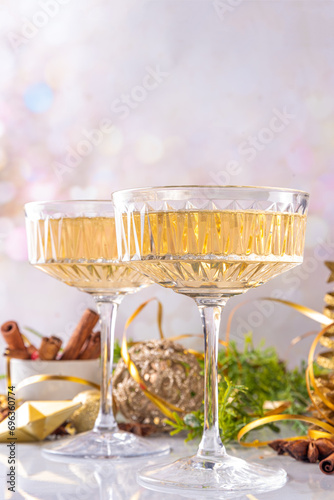Two champagne glass on Christmas decorated background
