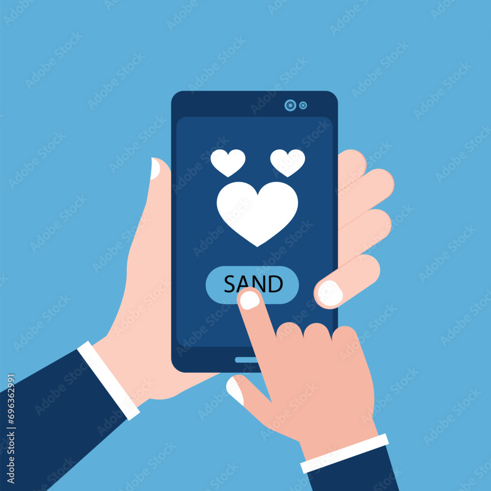 Sending love message concept. Hand holding phone with heart, send button on the screen. Finger touch screen