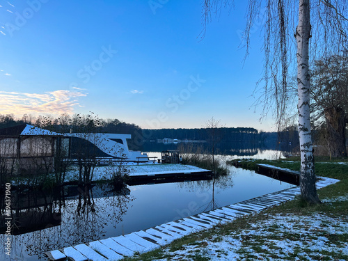 Lake shore in winter. A park. Snow. Winter evening. © fotorybalka