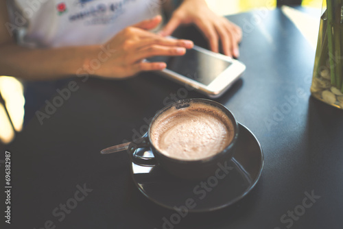 person pouring coffee into a cup