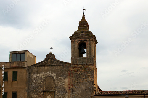 Picturesque landscape view of ancient bell tower of the Maria Santissima Assunta Church (Castelbuono) village, Sicily, Italy. The church built in the 14th century. Travel and tourism concept photo