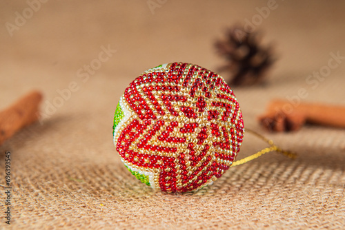 Fotografie Exquisite handmade Christmas bubble toy from beads, also known as a Christmas globe or Christmas bulb, is a part of holiday decor