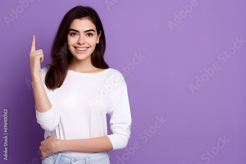 female model smiling and pointing at product, model for product promotion on blank background © manof