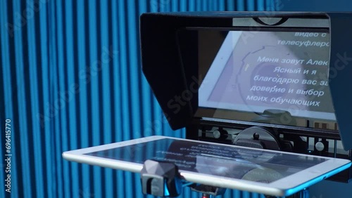 teleprompter for video. The reading text is reflected from the glass surface opposite the video camera lens