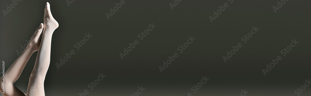 cropped banner of woman in sheer white pantyhose posing with raised legs on dark grey background - obrazy, fototapety, plakaty 